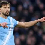 Man City Apoya a Dias Tras Robo; Guardiola Ausente, Doku Lesionado