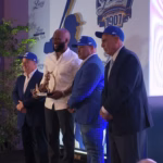 Mel Rojas Jr. receives the first Manny Mota Award from the Tigres del Licey